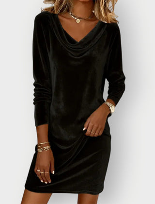 Black velvet drape-neck dress with long sleeves and cowl neckline, above-knee length.