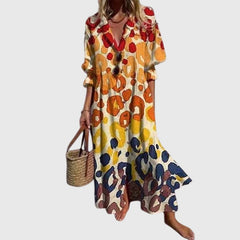 Bohemian dress with orange and yellow animal-like spots, V-neck, short sleeves, flared hem
