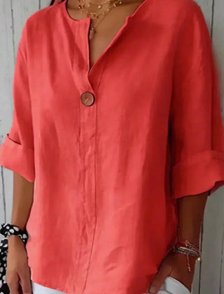 Relaxed red button-up top with V-neck and short sleeves, front button placket.