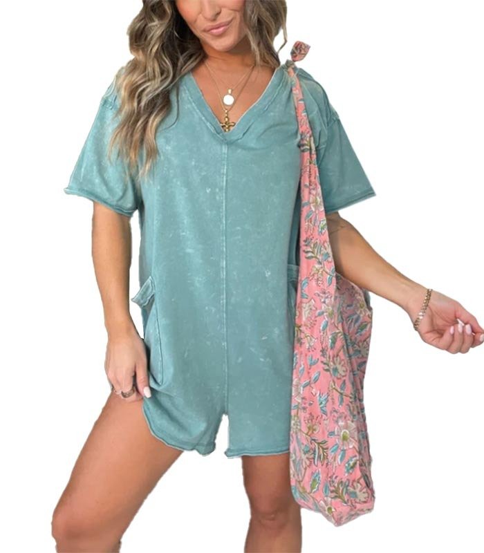 Washed gray-green short-sleeve V-neck romper with patch pockets and relaxed fit