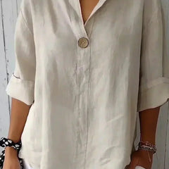 Relaxed off-white button-up top with V-neck and short sleeves, front button placket.