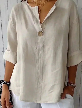 Relaxed off-white button-up top with V-neck and short sleeves, front button placket.