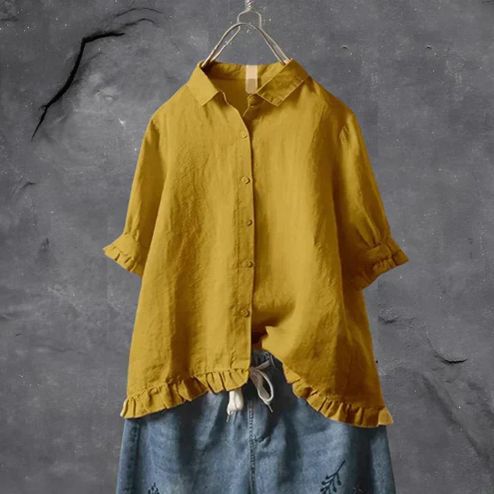Mustard yellow button-up blouse top with collar, short sleeves, and ruffled hem