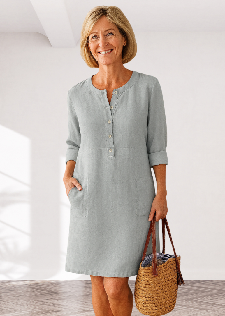 Light gray linen-look everyday dress with front buttons and side pockets, three-quarter sleeves