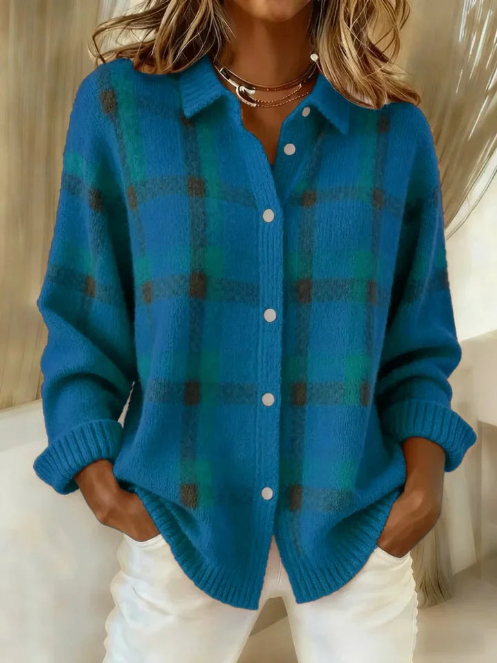 Blue plaid knit vest with V-neck, button front, long sleeves, ribbed cuffs.