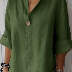 Relaxed green button-up top with V-neck and short sleeves, front button placket.