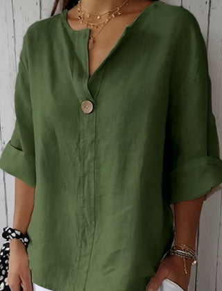 Relaxed green button-up top with V-neck and short sleeves, front button placket.