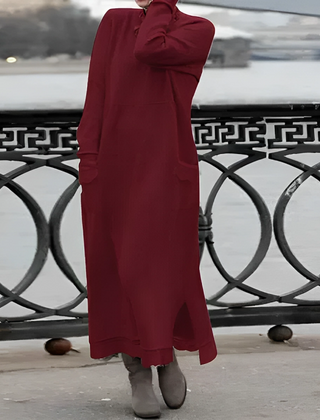 Red hooded winter maxi dress with long sleeves, front pockets, and side slit