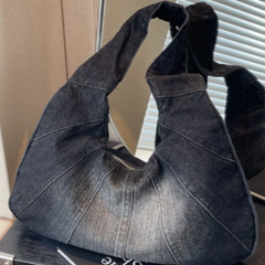 Denim shoulder bag in charcoal with wide top handles and slouchy crescent shape
