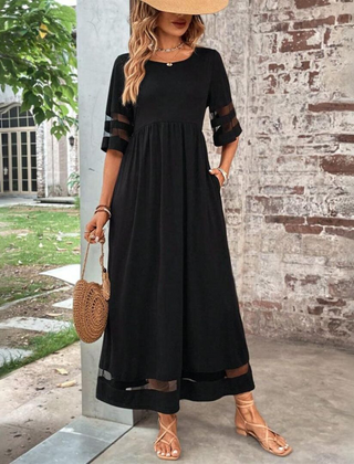 Black midi dress with gathered waist, elbow sleeves with sheer stripe, tiered hem