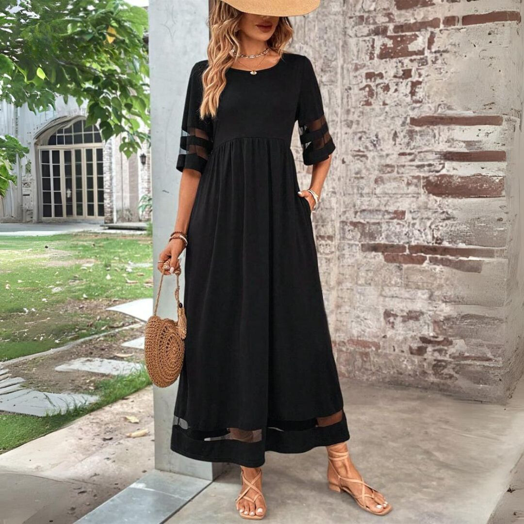 Black midi dress with gathered waist, elbow sleeves with sheer stripe, tiered hem