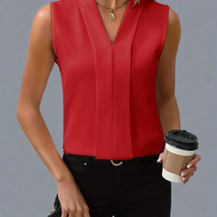Red sleeveless V-neck blouse with front pleats