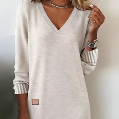 White V-neck knit dress with 3/4 sleeves, ribbed striped cuffs, small square side patch