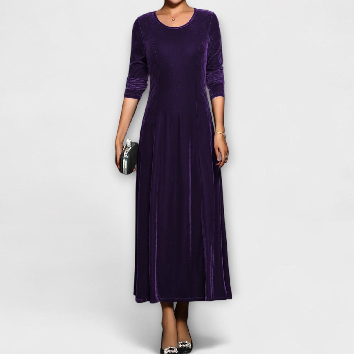 Purple soft velvet dress with long sleeves, round neck, fitted bodice and midi skirt