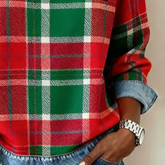 Plaid top close-up with denim cuff trim, red-and-green grid pattern