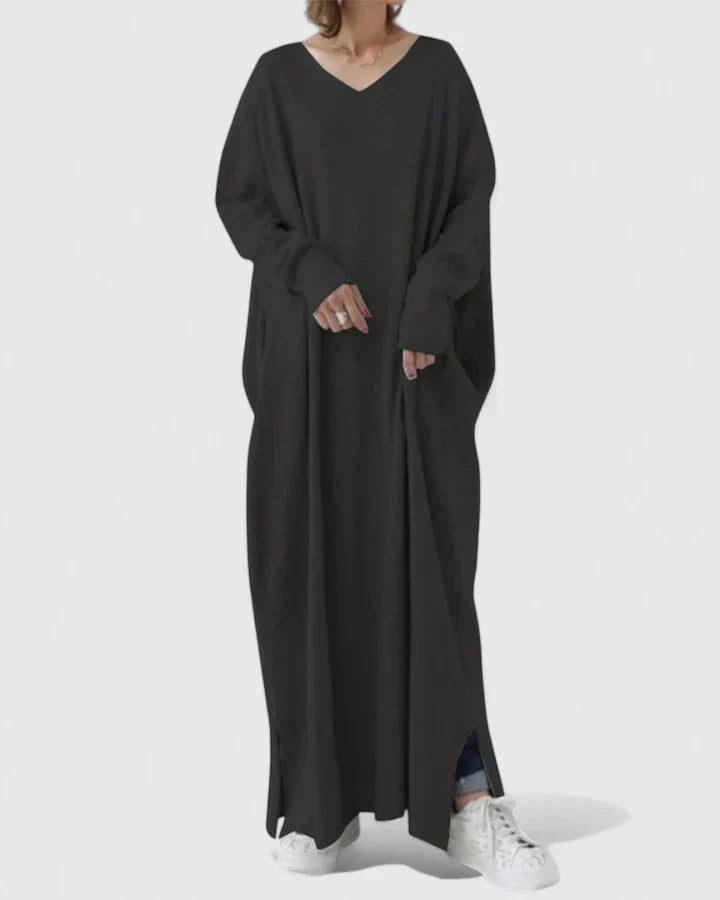 Black long-sleeve maxi dress with V-neck and loose draped silhouette, side slit