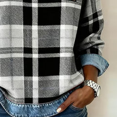 Plaid top close-up with denim cuff trim and black-and-white grid pattern