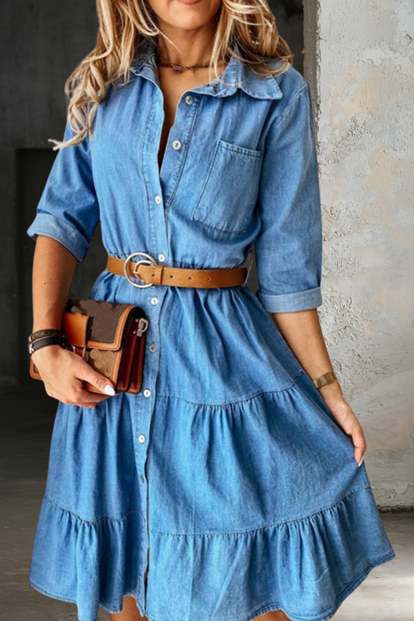 Light blue denim shirt dress with collar, button placket, belt, and tiered hem