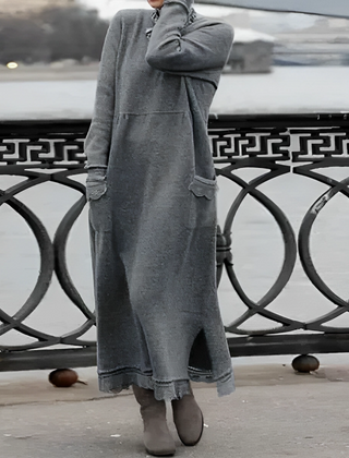 Grey hooded winter maxi dress with long sleeves, front pockets, and side slit