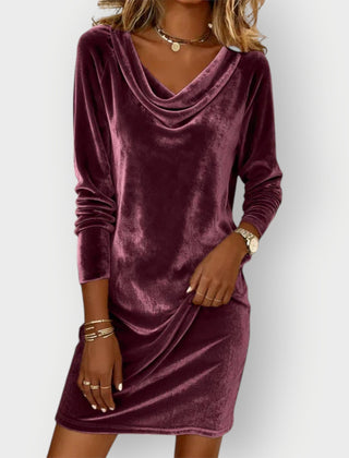 Purple velvet drape-neck dress with long sleeves and cowl neckline, above-knee length.