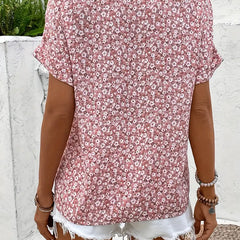 Pink floral print blouse with short dolman sleeves and button-front detail (back view)