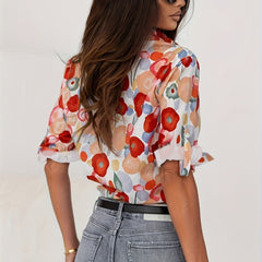 Colorful floral blouse in side view, button-front and long sleeves