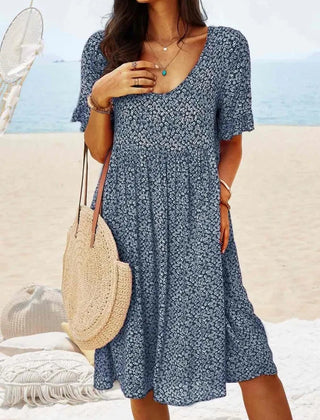 Navy floral babydoll dress with V-neck and short sleeves, knee-length