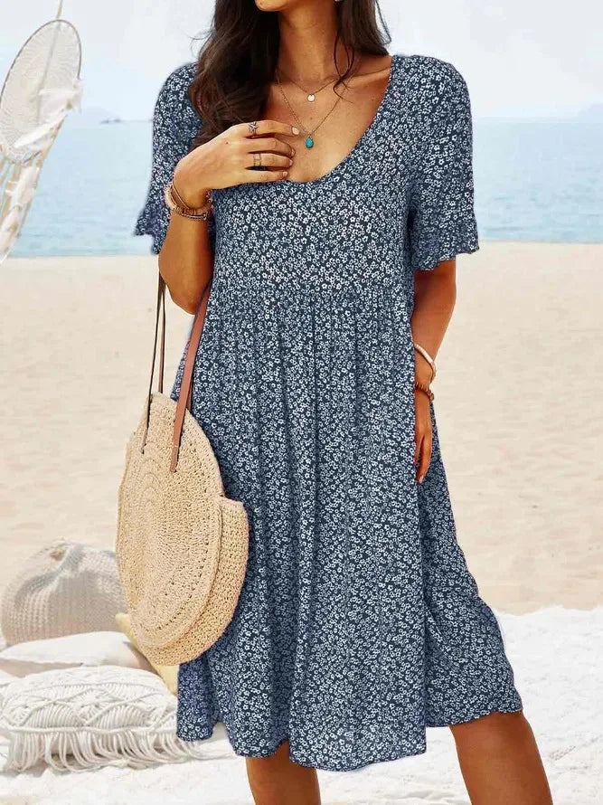 Navy floral babydoll dress with V-neck and short sleeves, knee-length