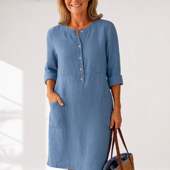 Light blue linen-look everyday dress with front buttons, three-quarter sleeves, side pockets
