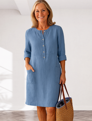 Light blue linen-look everyday dress with front buttons, three-quarter sleeves, side pockets