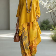 Mustard yellow long tunic top and wide-leg printed pants set with draped ruffle hem