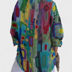 Rose™ geometric print blouse back view with rounded yoke and wide sleeves