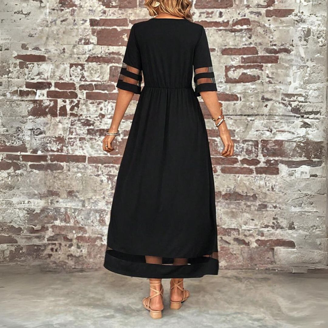 Black midi dress, gathered waist, back view with sheer sleeve stripe and hem band