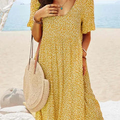 Yellow floral babydoll dress with V-neck and short sleeves, knee-length