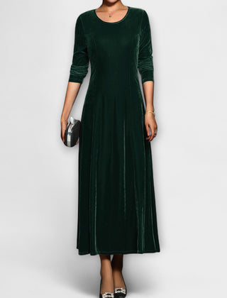 Green soft velvet dress with long sleeves, round neck, fitted bodice and midi skirt