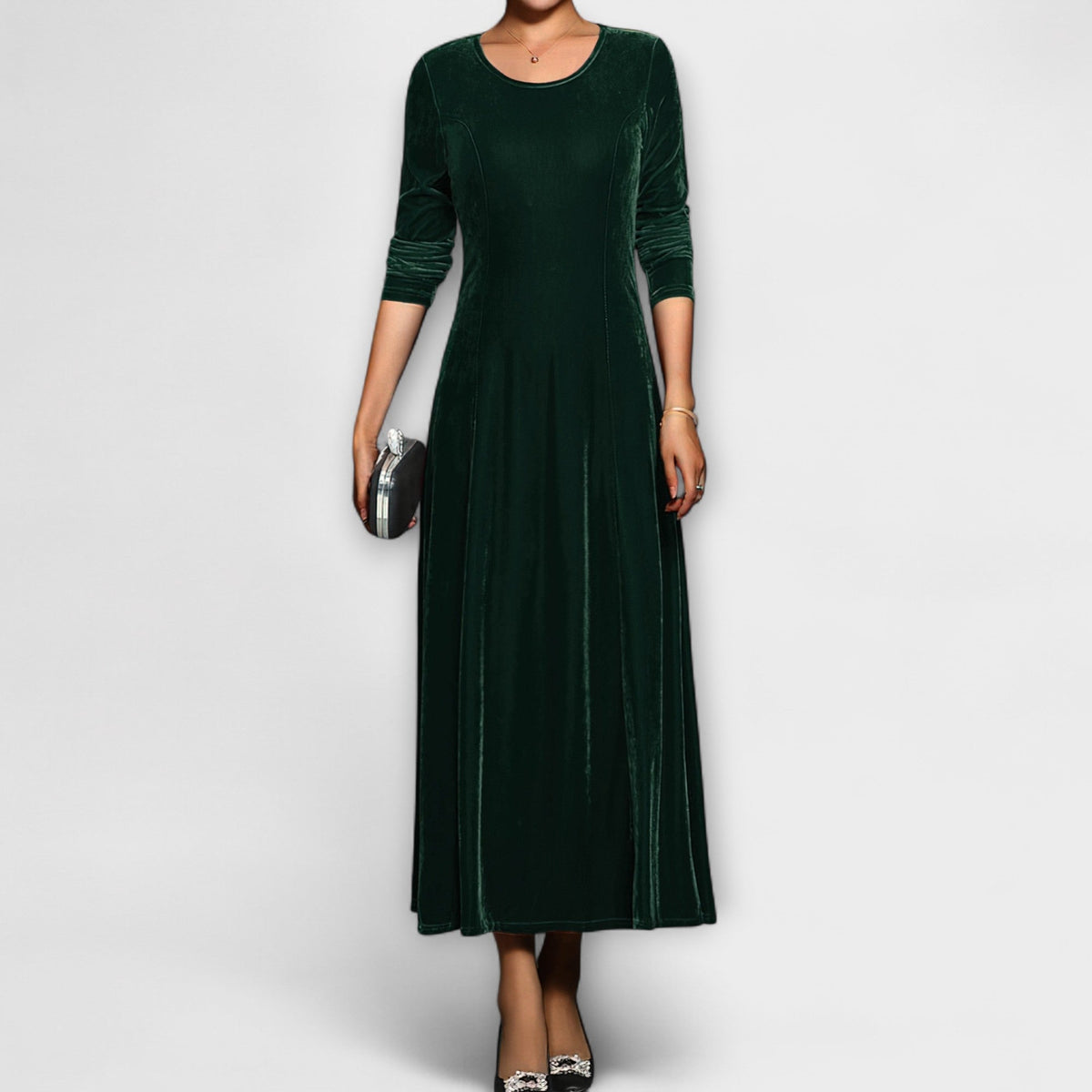 Green soft velvet dress with long sleeves, round neck, fitted bodice and midi skirt