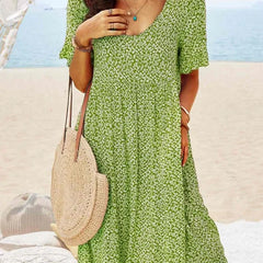 Green floral babydoll dress with V-neck and short sleeves, knee-length
