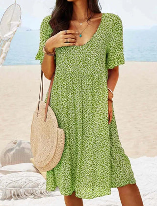 Green floral babydoll dress with V-neck and short sleeves, knee-length