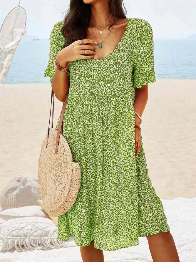 Green floral babydoll dress with V-neck and short sleeves, knee-length