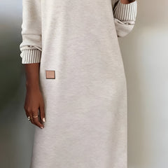 White V-neck knit midi dress detail view of square side patch and ribbed cuffs