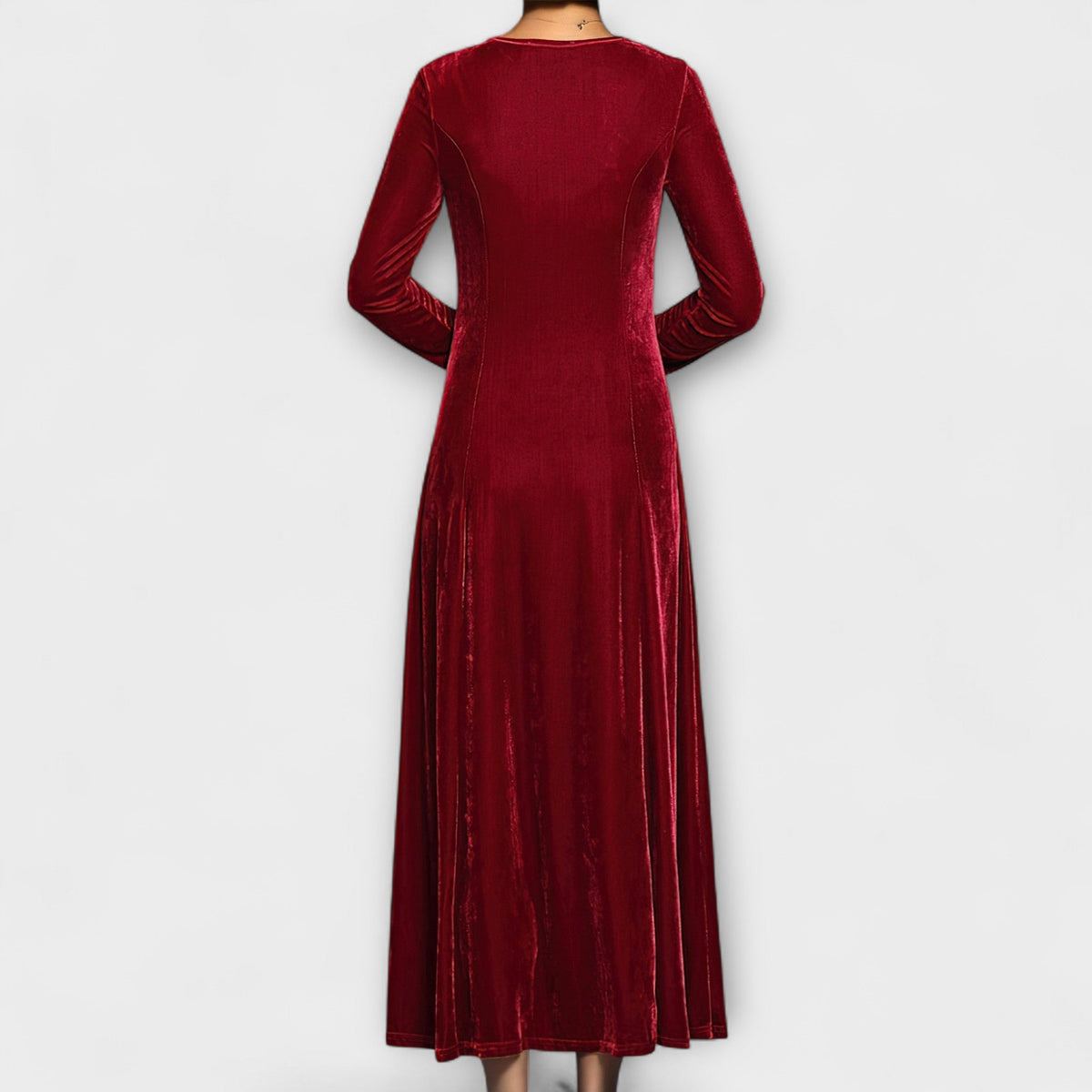Red soft velvet dress back view with long sleeves and midi length flowy skirt