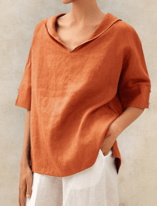 Oversized linen shirt in tangerine orange with V-neck and short sleeves