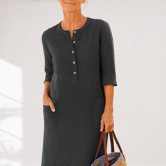 Black linen-look everyday dress with front buttons, three-quarter sleeves, side pockets
