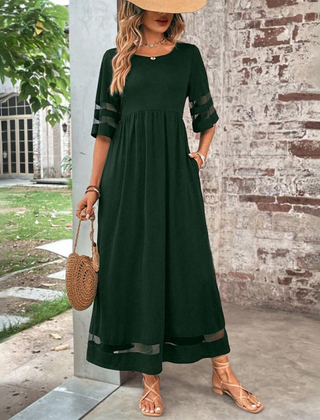 Green midi dress with gathered waist, elbow sleeves with sheer stripe, dark hem band