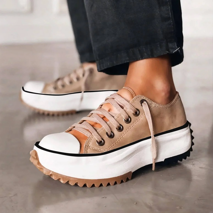 Brown lace-up platform shoes with white sole, black trim and padded tongue