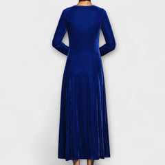 Blue velvet dress back view with long sleeves and midi length flowy skirt