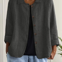 Charcoal gray button-front light top with pointed collar and three-quarter sleeves