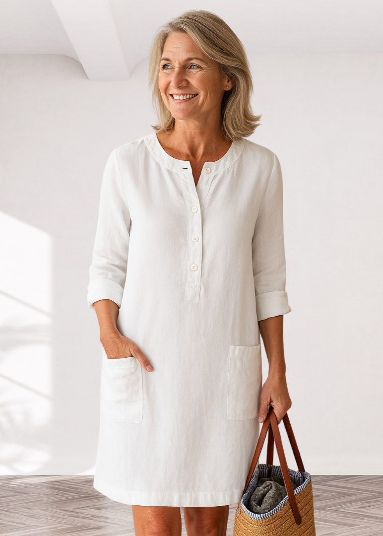 White linen-look everyday dress with front buttons and side pockets, three-quarter sleeves
