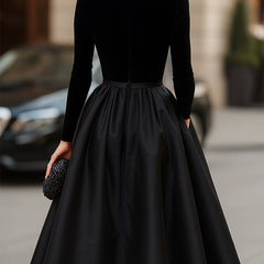 Black midi dress back with high neckline, long sleeves, and flared skirt with center seam
