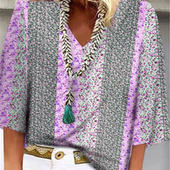 Multicolor floral-print blouse with V-neck tassel trim and flared sleeves